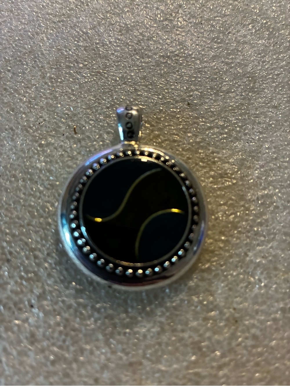 Round Silver Pendant with Black Inlay and Gold Accents